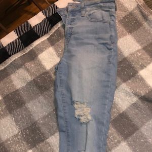 Light jeans with ripped knees